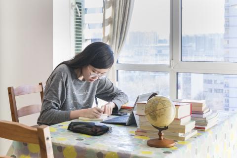 China. A student studies at home